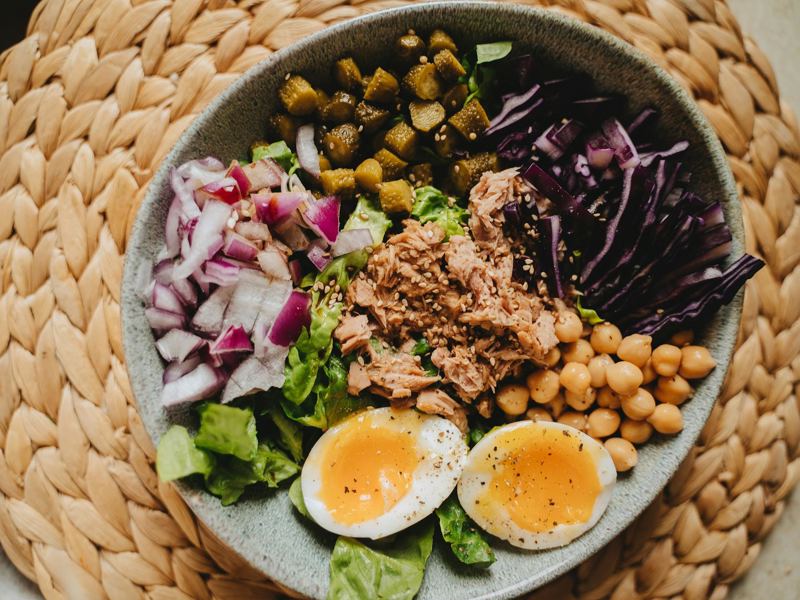 delicious salad bowl with tuna, eggs, and fresh vegetables, perfect fo image